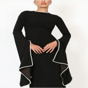 Elegant black evening dress with pearl trim on neckline and flared cuffs details