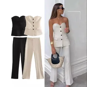 Chic women's two-piece set featuring a strapless buttoned corset and straight trousers