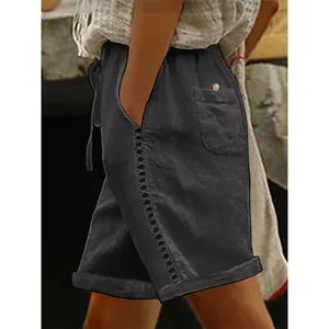 Side view of women's casual black shorts with lace hollow-out stitching detail.