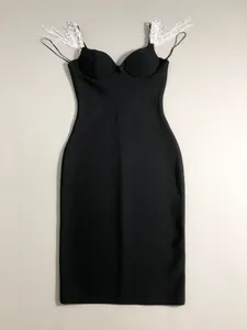 Detailed view of a black bandage bodycon dress featuring elegant fringe rhinestone tassels