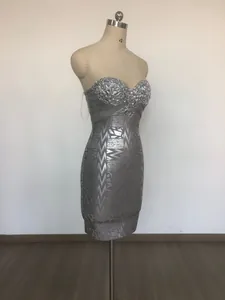 Detailed side view of luxury silver bandage evening dress with sequined sweetheart bodice
