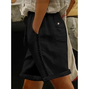 Detailed side view of black casual shorts featuring elegant lace hollow patchwork
