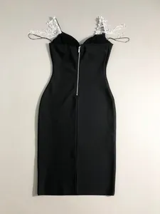 Detailed back view of a black bandage dress with sparkling rhinestone fringe straps