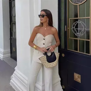 Elegant women's two-piece set featuring a strapless button-down top and matching trousers