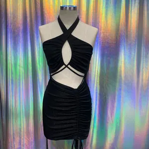 Close-up of black glittery halter mini dress with sexy cut-out and ruched details
