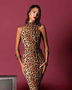 Detail view of a glamorous leopard print sequin dress with a sexy halter neck design.