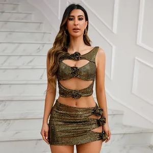 Detailed view of a gold sequin two-piece set featuring cut-outs and rosettes.