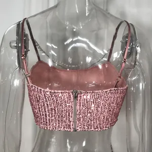 Back view of pink sequined camisole crop top featuring thin straps and rear zipper