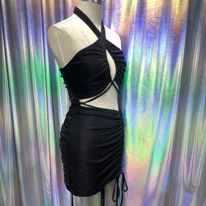 Close-up detail of a sexy black ruched halter mini dress with shimmery glitter fabric