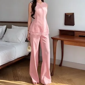 Elegant pink sleeveless lace peplum top and wide-leg trousers fashion two-piece set