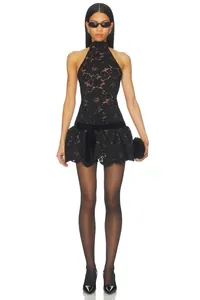 Detailed view of sexy black lace halter mini dress with bow and eyelash trim