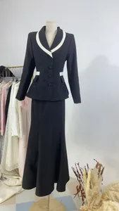 Full view of black French design blazer and maxi skirt set on a mannequin