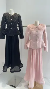 Detailed view of French floral collar tweed jacket and pleated skirt sets in black and pink