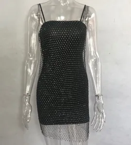 Detail of sexy black mesh camisole dress featuring sparkling rhinestone embellishments.
