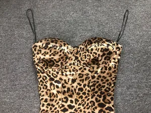 Detailed view of the bold leopard print and silky fabric of this slim-fit maxi dress