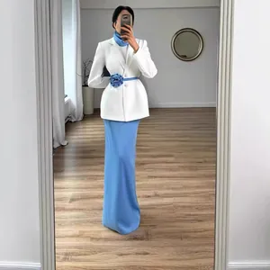 Elegant white blazer and light blue maxi skirt set featuring a blue 3D floral belt accessory