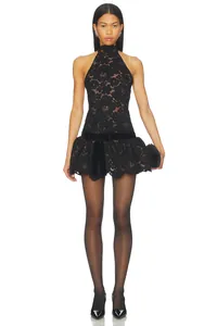 Detailed view of elegant black lace halter mini dress with bow waist and ruffled hemline