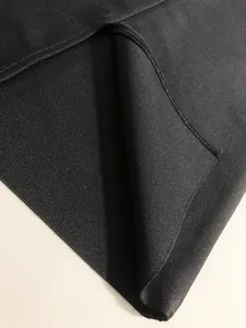 Close-up view of the premium black bandage fabric texture and high-quality seam detailing