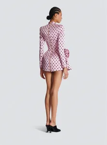 Elegant pink polka dot mini dress with long sleeves and 3D flower detail back view