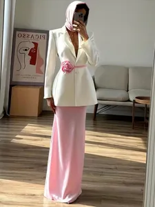 Elegant white blazer and pink maxi skirt set with decorative 3D floral belt detail