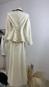 Detailed back view of French style peplum blazer with elegant corset lacing