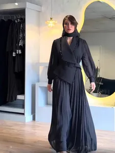 Elegant black pleated two-piece set with large lapel design for modest fashion wear.