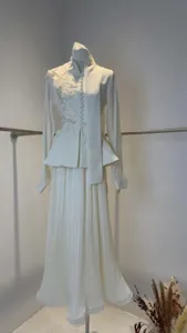 Elegant white two-piece suit set with floral embroidery and pleated skirt detail