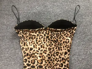 Detail of sexy leopard print maxi dress showing sweetheart neckline and thin straps.