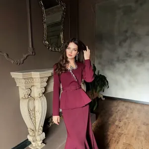 Elegant burgundy suit set featuring crystal V-neck detail and peplum waistline design