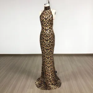 Seductive leopard print sequin evening gown featuring a halter neck and open back design