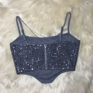 Detailed view of grey sequined camisole featuring elegant pearl chain straps and back zipper