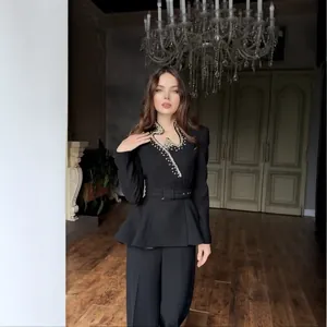 Elegant women's black peplum blazer suit with sparkling rhinestone V-neck detail