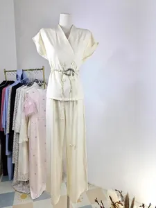 Elegant two-piece set featuring short-sleeve blazer top and high-waist straight pants