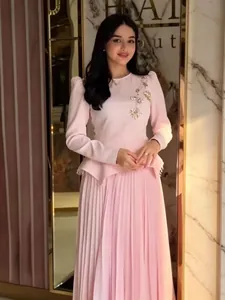 Elegant pink round neck long sleeve dress with pleated skirt and floral sequins