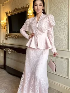 Elegant pink lace two-piece skirt set with V-neck peplum jacket and floral embroidery detail