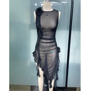 Sexy sleeveless black mesh dress with ruffles and asymmetrical hem detail on mannequin