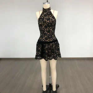 Detailed view of the black halter lace mini dress featuring a waist bow and eyelash lace hem