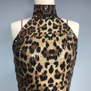 Close-up of leopard print sequin dress with high halter neck on a mannequin.