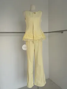 Sleeveless lace-trimmed peplum top and wide-leg trousers two-piece set in yellow