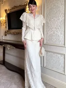 Elegant white lace embroidery set featuring a large shawl collar and long maxi skirt.