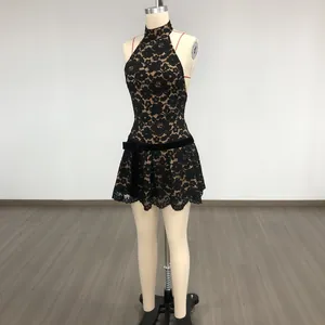 Detailed view of a black lace halter mini dress with a waist bow and eyelash lace hem.