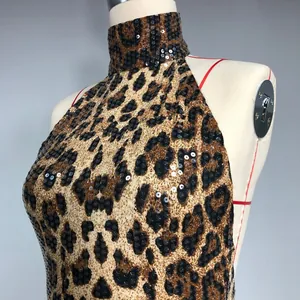 Detailed view of sexy leopard print sequin halter dress featuring high neck design