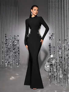 Elegant black mermaid bandage evening dress with sheer mesh and rhinestone side details.