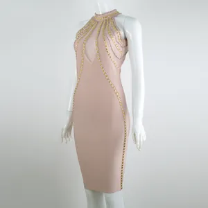 Abito a fascia modello halter con borchie dorate e dettaglio in mesh sul petto