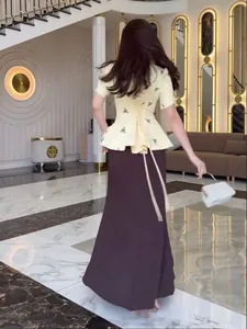 Elegant floral puff sleeve peplum top and brown long skirt two-piece outfit for summer