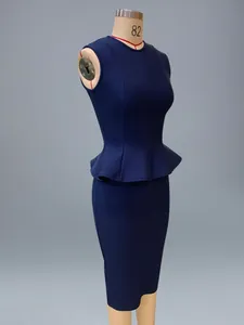 Detailed side view of navy blue bandage peplum top and pencil skirt on dress form