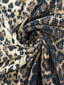 Close-up showing the shimmering sequins on a stylish leopard print textile material