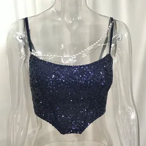 Close-up detail of navy blue sequined camisole with pearl and silver chain straps.