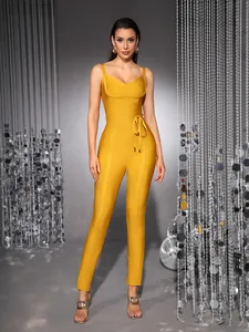 Premium yellow V-neck bandage jumpsuit featuring a waist tie and slim fit design