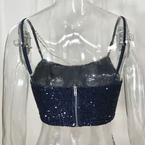 Detailed view of navy blue sequined crop top featuring a back zipper and pearl chain